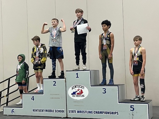 JCMS student Max Foster takes his place at the top after winning the KY Youth Wrestling State Championship